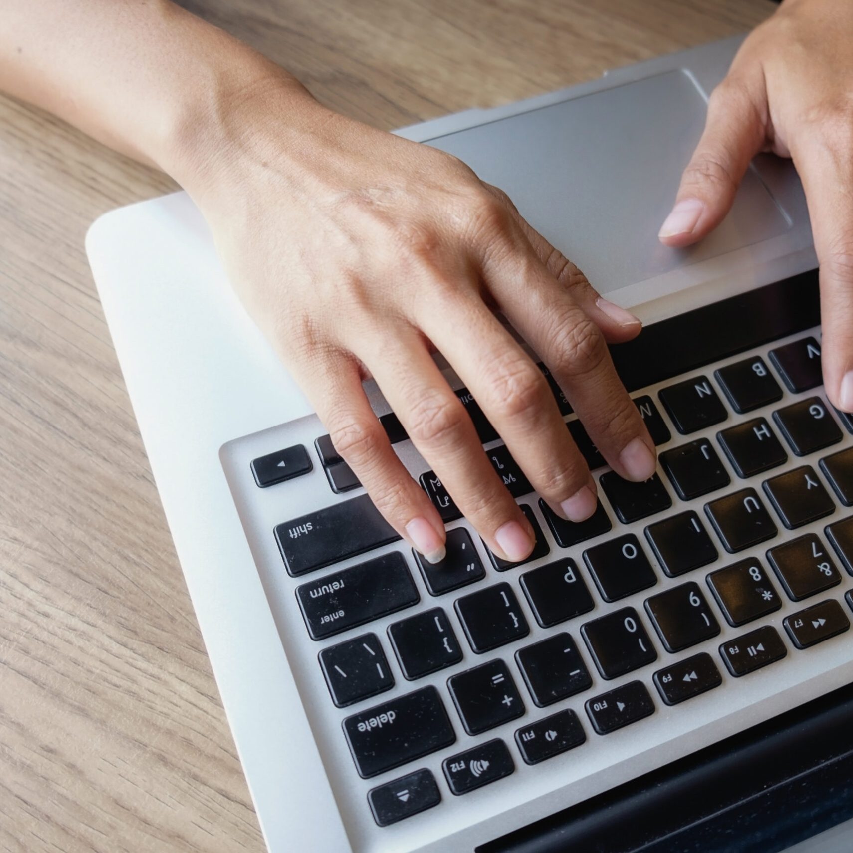 businesswoman use on-line via laptop computer for analyzing financial chart,writing business plan,open net-book,smart watch,tablets,with copy space screen,morning light,vintage color